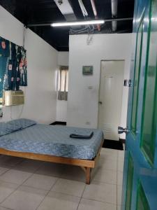 Postel nebo postele na pokoji v ubytování A place to stay in Cebu City + 2 fotografie