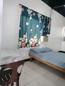 Postel nebo postele na pokoji v ubytování A place to stay in Cebu City