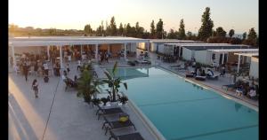 an overhead view of a building with a swimming pool at Apica Village in Mirto