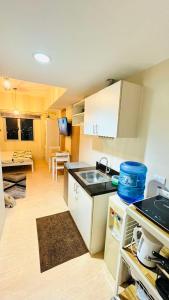 a kitchen with a sink and a counter top at SUNVIDA TOWER, across SM City Cebu in Mandaue City