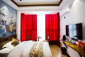 โทรทัศน์และ/หรือระบบความบันเทิงของ Qinghe Art Hotel