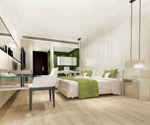 Rúm í herbergi á Hotel Vila Grand Near IGI Airport
