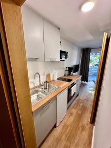 a kitchen with a sink and a counter top at Ost See Blick Ferienwohnung Nr1 Baabe in Baabe