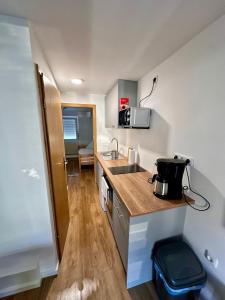 a small kitchen with a sink and a counter top at Ost See Blick Ferienwohnung Nr1 Baabe in Baabe