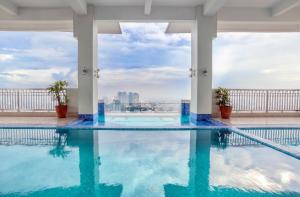 a swimming pool on the roof of a building at EK's Place in Manila
