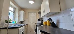 a kitchen with a sink and a counter top at OG Stays V in Pallion