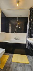 a bathroom with a bath tub and a sink at OG Stays V in Pallion