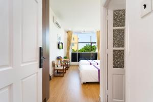 TV a/nebo společenská místnost v ubytování The Sim Hotel Vung Tau