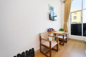 TV a/nebo společenská místnost v ubytování The Sim Hotel Vung Tau