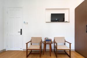 TV a/nebo společenská místnost v ubytování The Sim Hotel Vung Tau