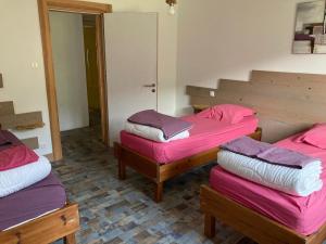 En eller flere senge i et værelse på Le Gîte d'Orion