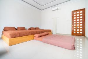 Postel nebo postele na pokoji v ubytování Villa Luxe Banguntapan