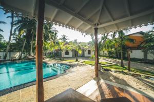 a view of a swimming pool in a villa at Sisikirana Villa (Luxury Villa in Galle) in Unawatuna +26 photos