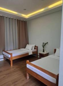 Postel nebo postele na pokoji v ubytování JAL Transient House