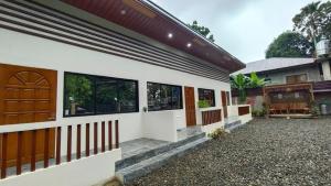 a rendering of a house with a garage at JAL Transient House in Hinoba-an