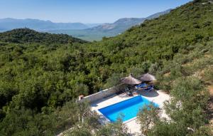 an aerial view of a resort with a swimming pool at Country house Maslina by Villas Guide in Metković