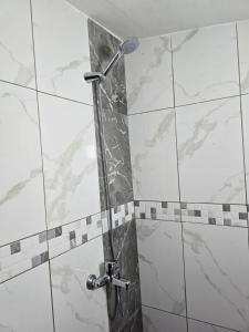 a shower in a bathroom with a glass door at TRiAD in Vlorë +40 photos