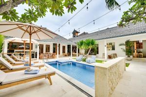 an exterior view of a villa with a swimming pool at Villa Mawali in Legian