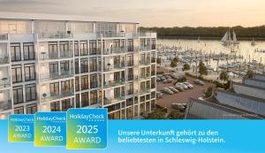 an image of an apartment building with a marina at Dockside Travemünde in Travemünde