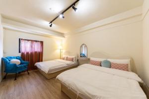 Voodi või voodid majutusasutuse 土象星座包棟住宿 toas