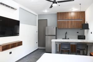 Kuchyň nebo kuchyňský kout v ubytování Apartamentos 31