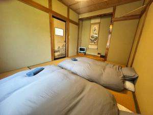 Katil atau katil-katil dalam bilik di Azetoshi Lodge