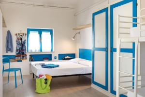 a bedroom with a bunk bed and a ladder at Villaggio San Paolo in Cavallino-Treporti +92 photos