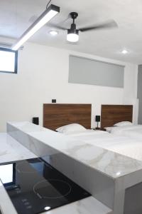 Postel nebo postele na pokoji v ubytování Apartamentos 31