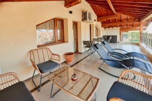 a living room with chairs and a table at Florance Rentals Luxury Apartments in Nessebar in Nesebar