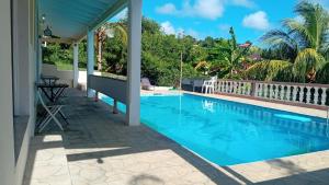 a view of a swimming pool from a house at Cummin up in Fort Jeudy