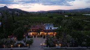 an aerial view of a house with a sunset at Villa Christina in Tolo