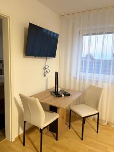 TV a/nebo společenská místnost v ubytování Appartementshaus Vlora 2 App 6