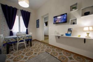 TV a/nebo společenská místnost v ubytování Casa Vacanza Terra Mia