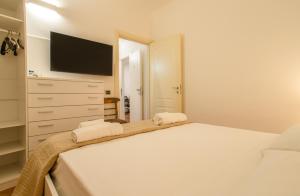 Ένα ή περισσότερα κρεβάτια σε δωμάτιο στο Porto Vecchio Rooms +32 φωτογραφίες