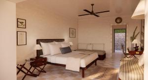 a bedroom with a bed and a ceiling fan at Makryammos in Limenas