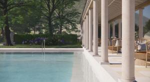 a swimming pool next to a house with columns at Makryammos in Limenas
