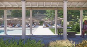 a rendering of a patio with tables and umbrellas at Makryammos in Limenas