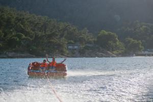 two people in a boat on a lake at Makryammos in Limenas