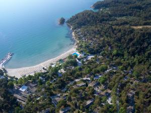 an aerial view of the shoreline of a beach at Makryammos in Limenas