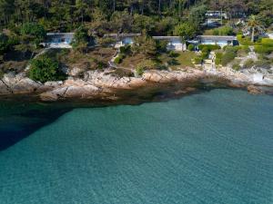 an aerial view of an island in the water at Makryammos in Limenas