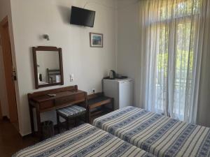 Pythaïs Hotel客房内的一张或多张床位
