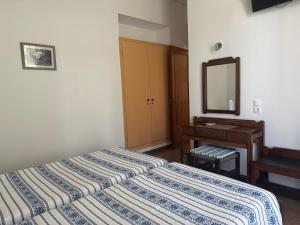 Pythaïs Hotel客房内的一张或多张床位