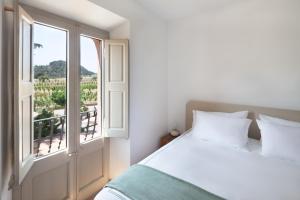 Postel nebo postele na pokoji v ubytování Hotel Dosterras