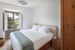 Postel nebo postele na pokoji v ubytování Hotel Dosterras