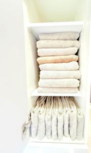 a closet filled with white towels at 西戸崎3丁目8番1号 in Fukuoka
