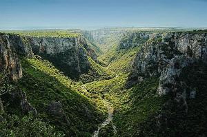 an aerial view of a canyon with green vegetation at Il Terrazzino in Laterza