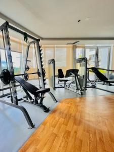 a gym with treadmills and elliptical machines at 45 Neutral Style Studio for 3 in Iloilo City