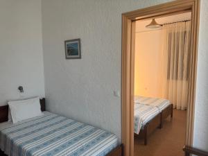 Pythaïs Hotel客房内的一张或多张床位