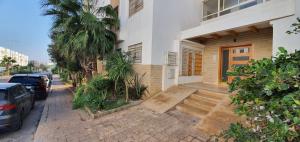 a house with a staircase leading to the front door at Ocean View Tamaris in Tamaris