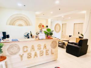 a store with a cashaya v salad sign in a room at Casa Ysabel Transient Inn in Ayusan Norte
